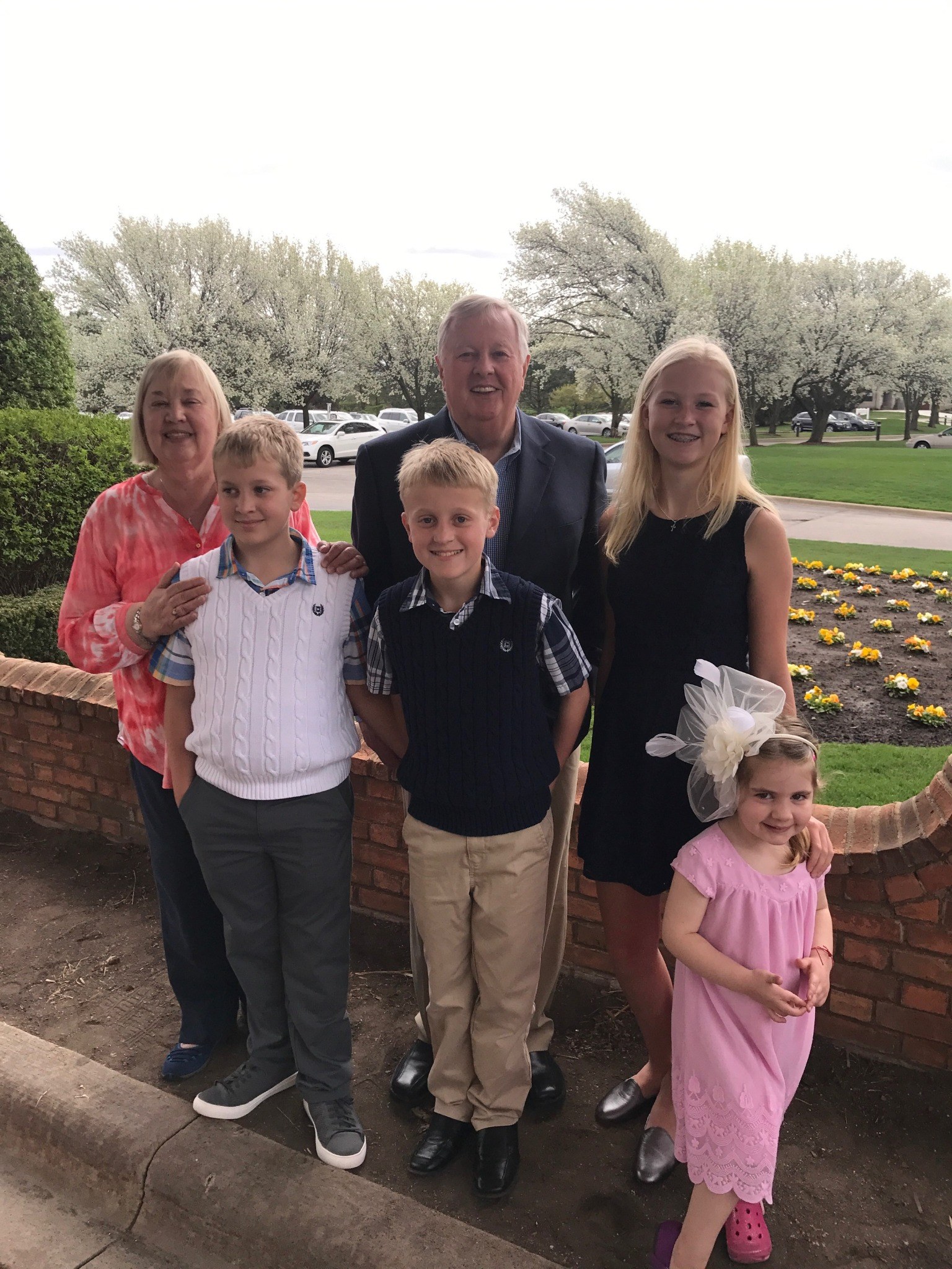 Tom with family outdoors