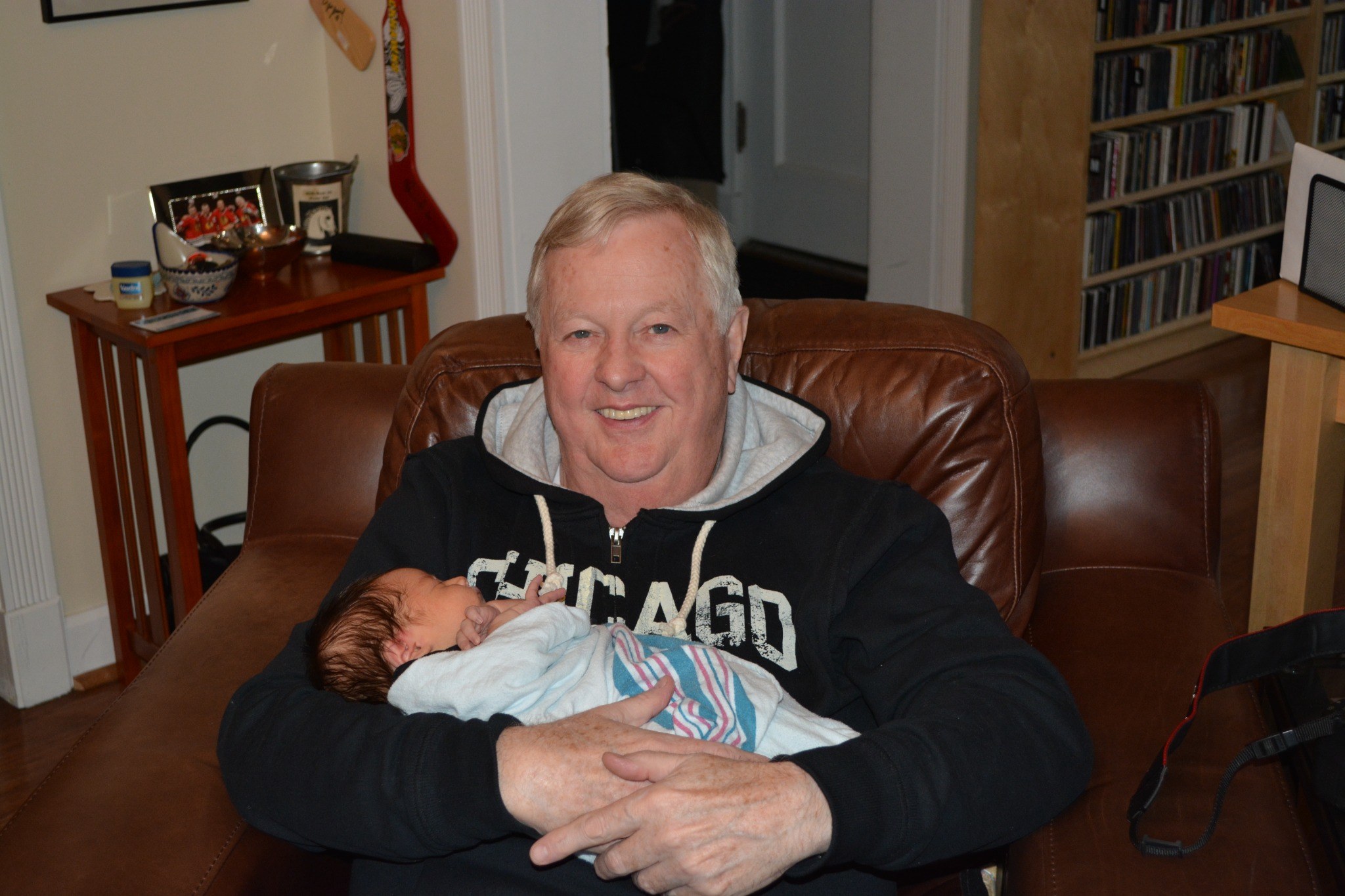 Tom holding a baby