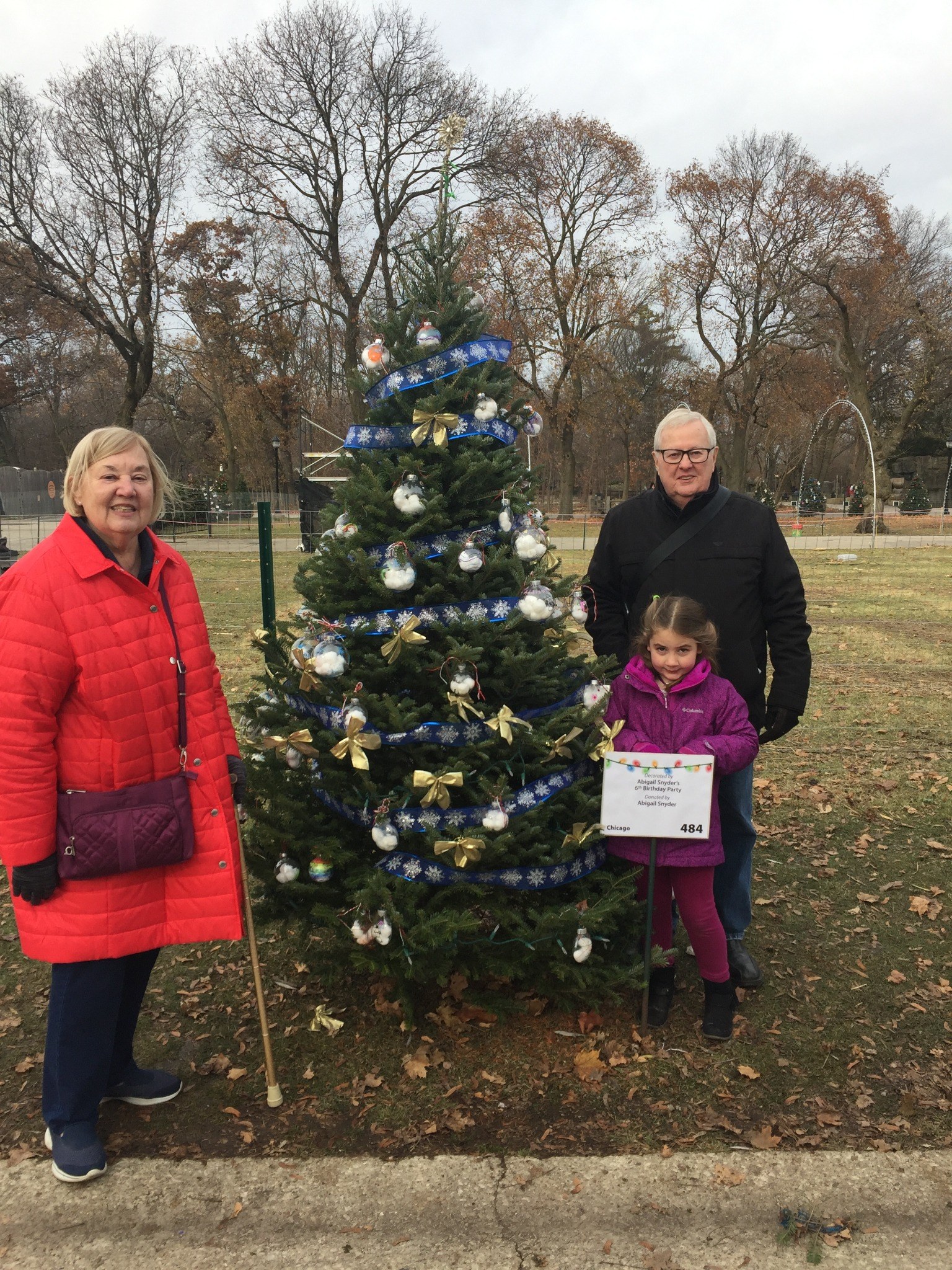 Tom and family by a holiday tree