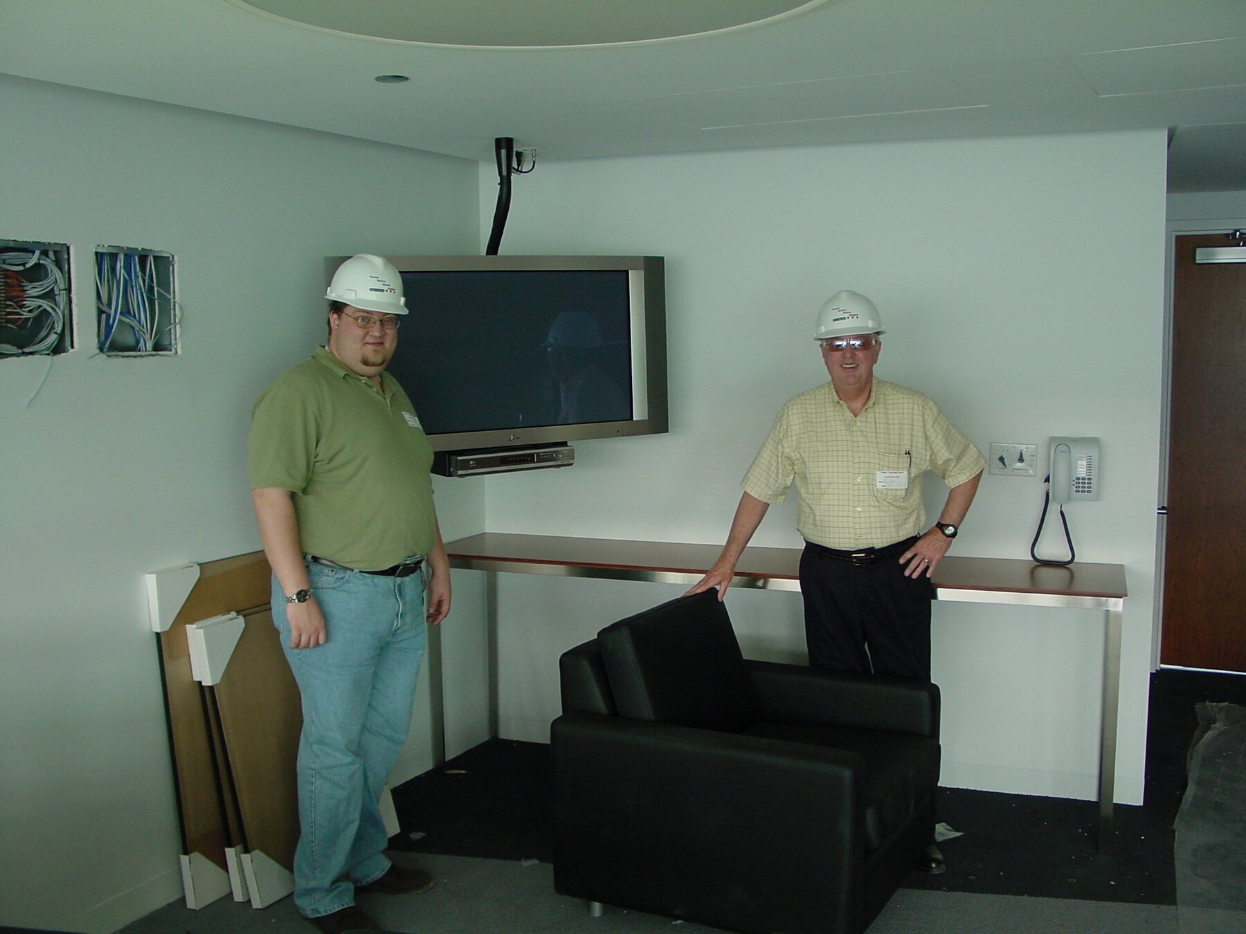 Tom Snyder and a family member working on an interior project