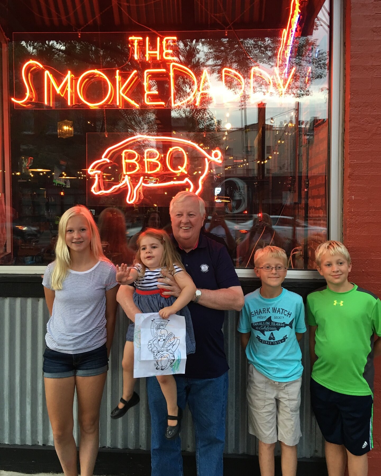Tom Snyder with family outside Smoke Daddy
